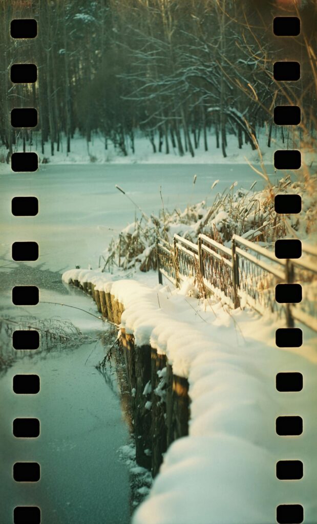 film roll showing a scene of snow and a lake that has been iced over